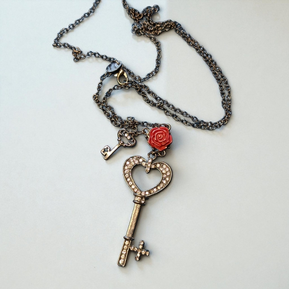 Elegant Silver Key Pendant Necklace with Red Rose